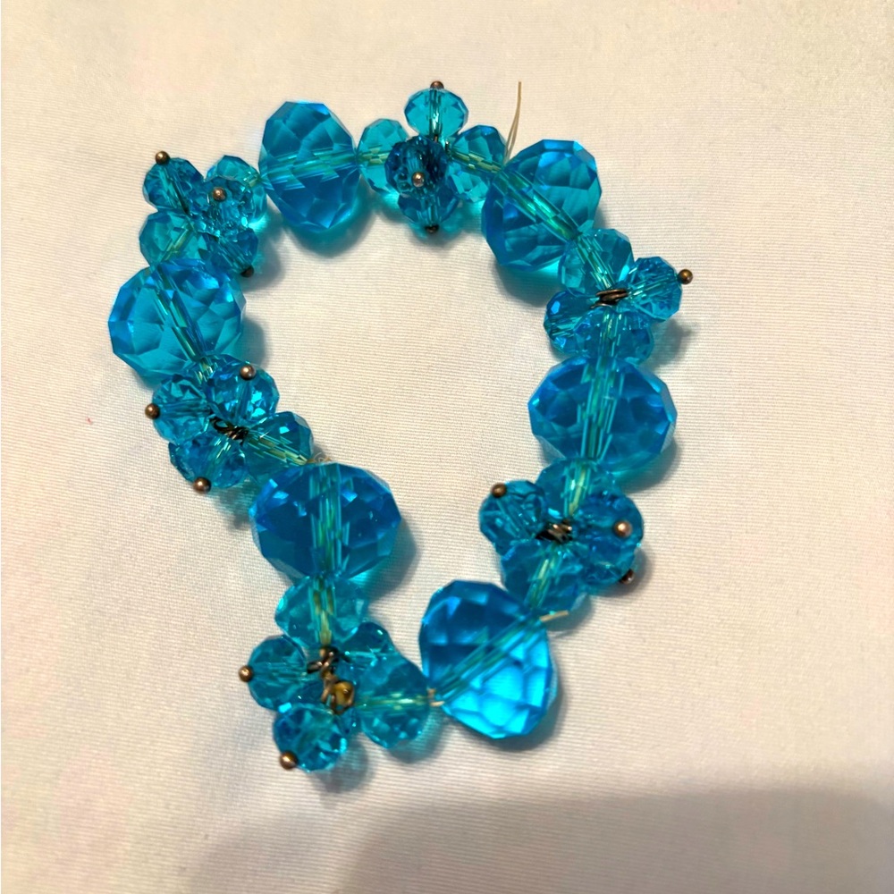 Brand new teal blue beaded stretch bracelet.